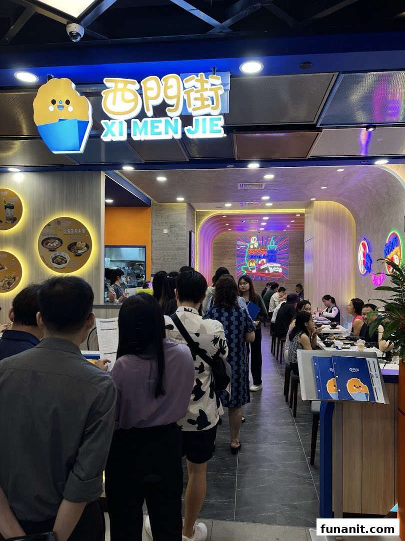 Customers queue at the vibrant entrance of Xi Men Jie, a Taiwanese eatery, under its distinctive logo.
