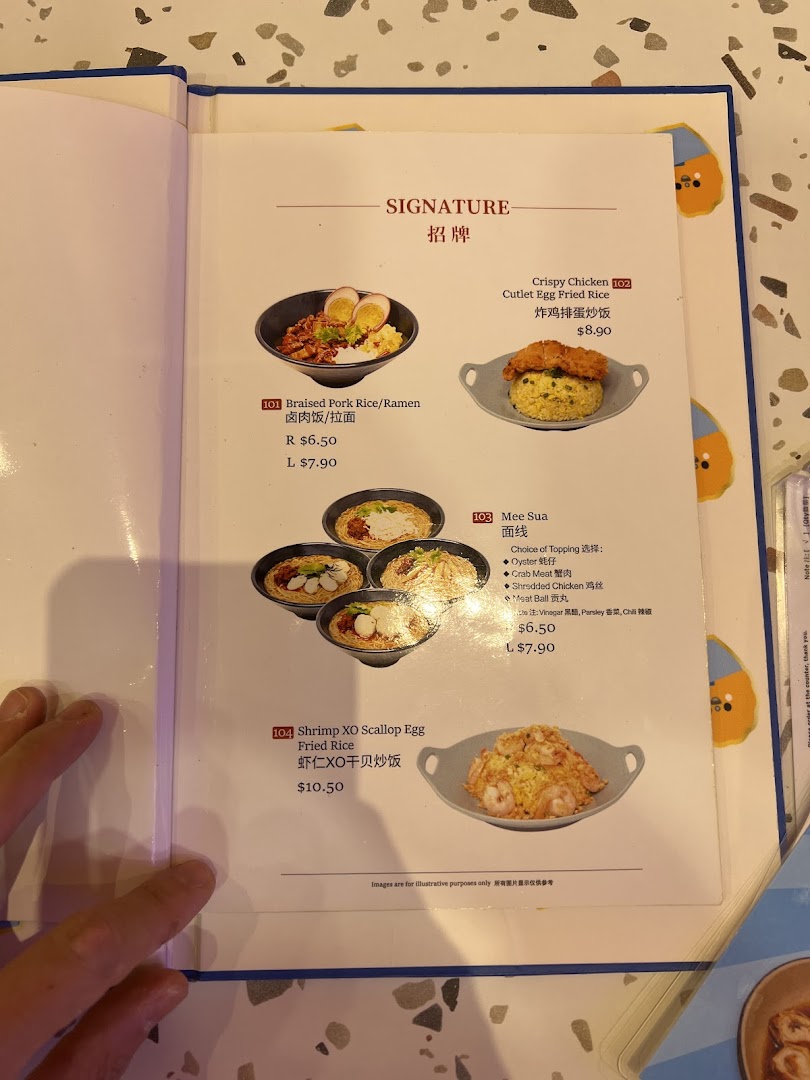 A close-up view of a menu page featuring signature Taiwanese dishes with prices and descriptions.