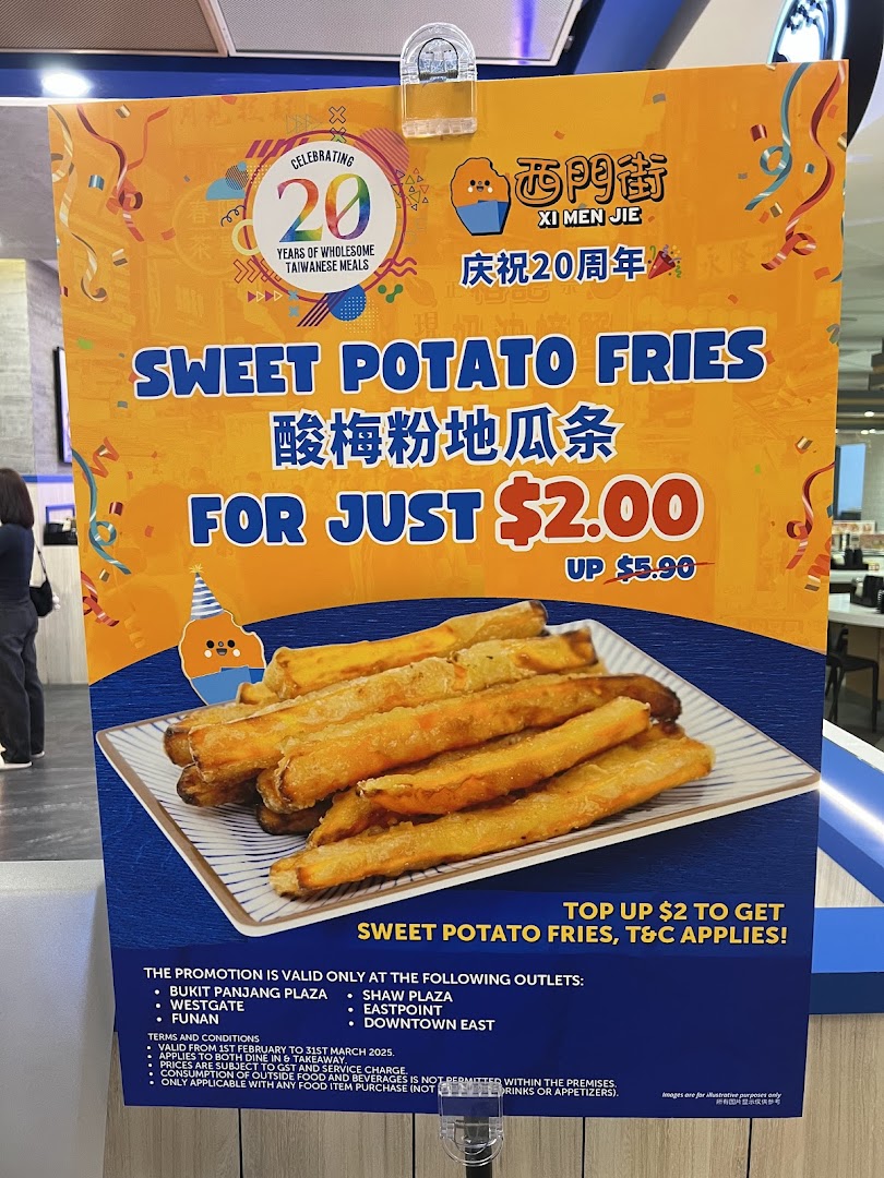 A promotional standee for Xi Men Jie's Sweet Potato Fries, highlighting a special offer.