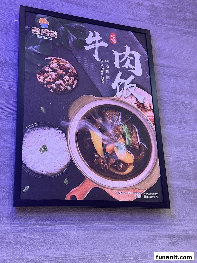 A framed poster showcasing a steaming bowl of Beef Stew Rice with white rice.