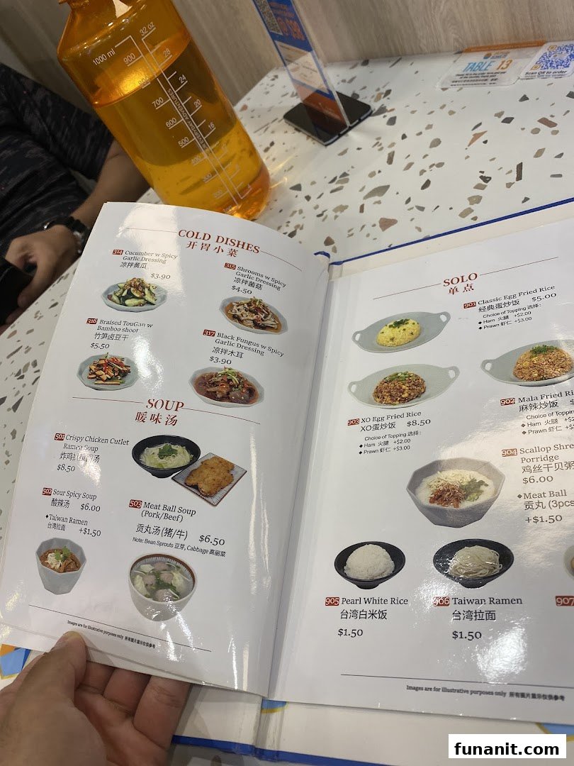 A detailed menu displaying various Taiwanese cold dishes, soups, and solo meals with prices.