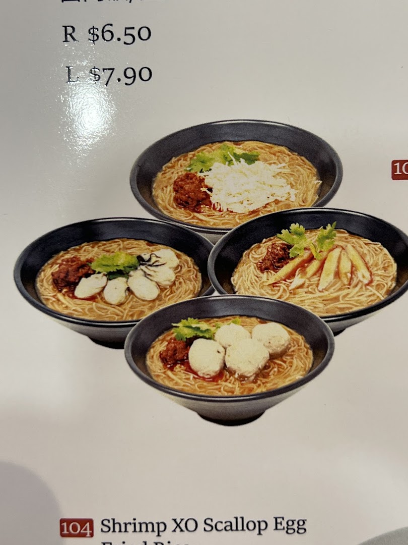 A menu page showcasing various Taiwanese noodle dishes with different toppings and their pricing.