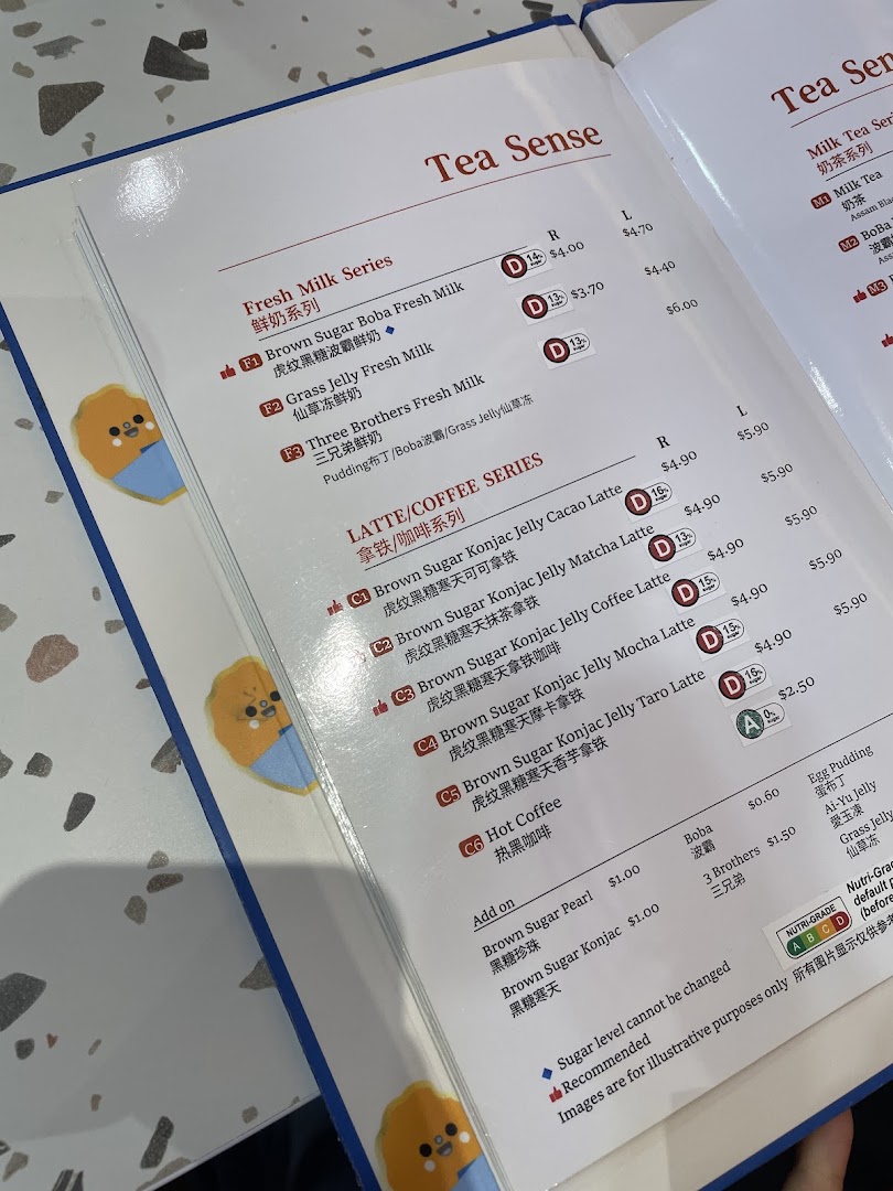 A detailed menu page showcasing various fresh milk, latte, coffee, and add-on options.