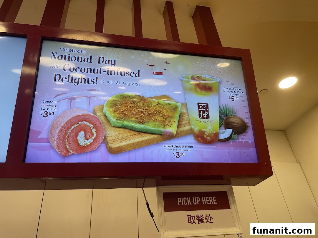 A digital menu board at Ya Kun Kaya Toast showcasing National Day coconut-infused delights and their prices.