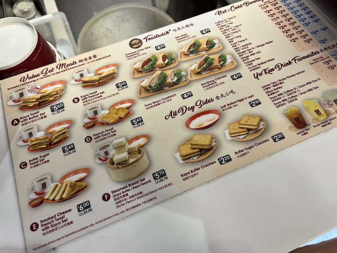 A detailed menu board from Ya Kun Kaya Toast, showcasing their signature toast sets, beverages, and sides.