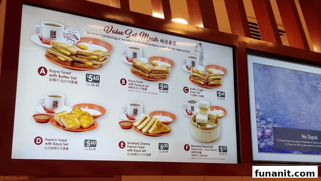 A digital menu board displaying various value set meals featuring toast, eggs, and beverages.