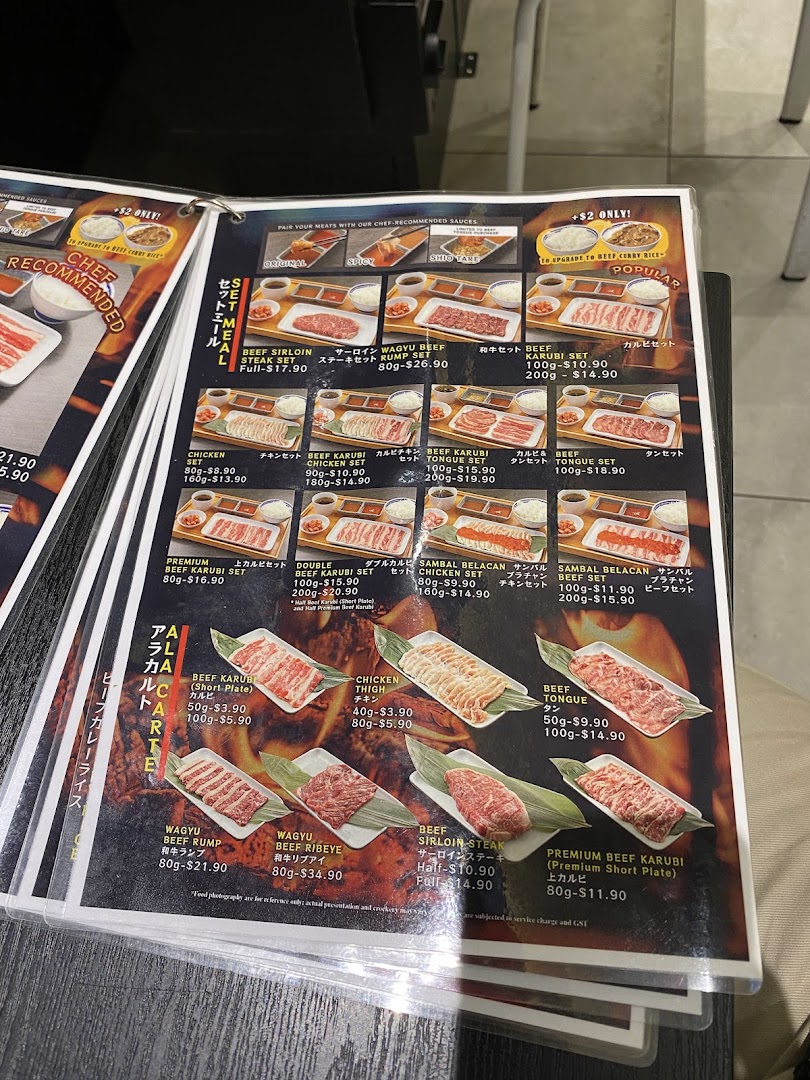 A detailed menu displaying various beef, chicken, and wagyu sets and a la carte options.