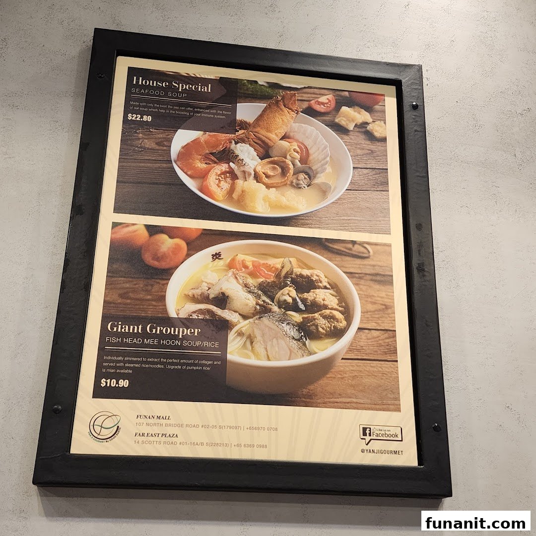 A menu board displaying two signature seafood soup dishes with prices and descriptions from Yan Ji Gourmet.