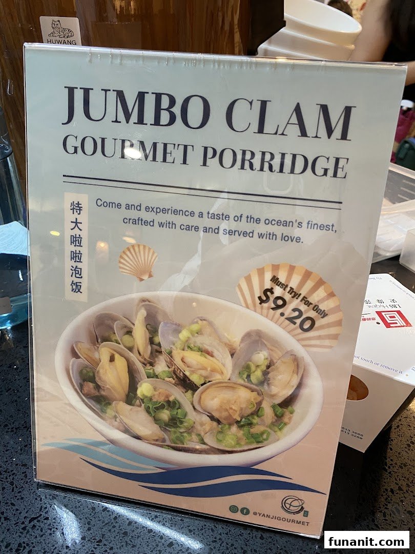A promotional standee featuring 'Jumbo Clam Gourmet Porridge' with a price of $9.20.