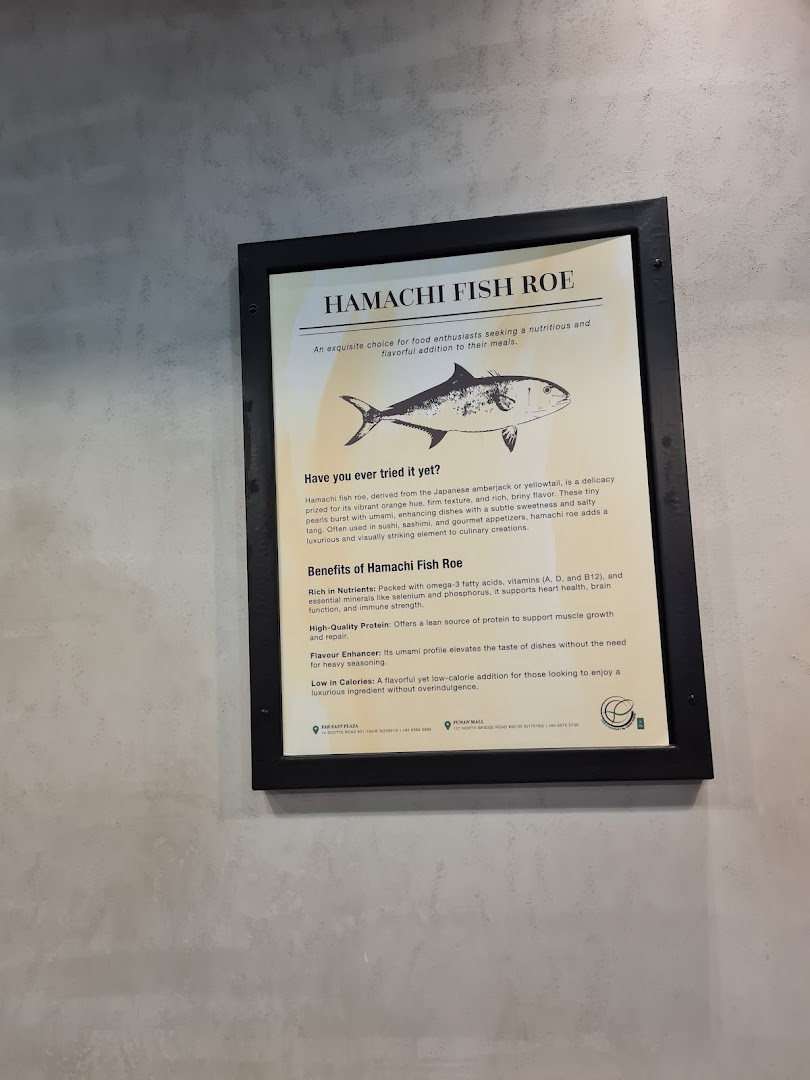 A framed informational sign on a wall, detailing the benefits and uses of Hamachi Fish Roe.