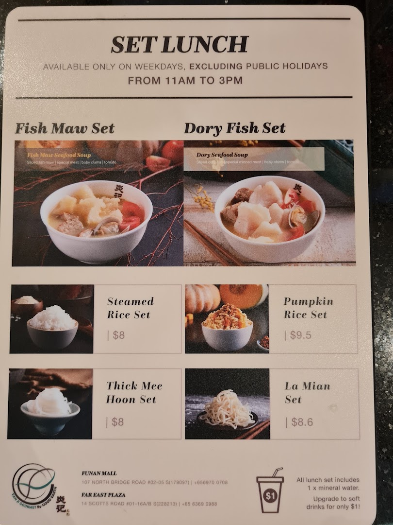 A detailed menu displaying set lunch options, including seafood soups and various rice/noodle sets.