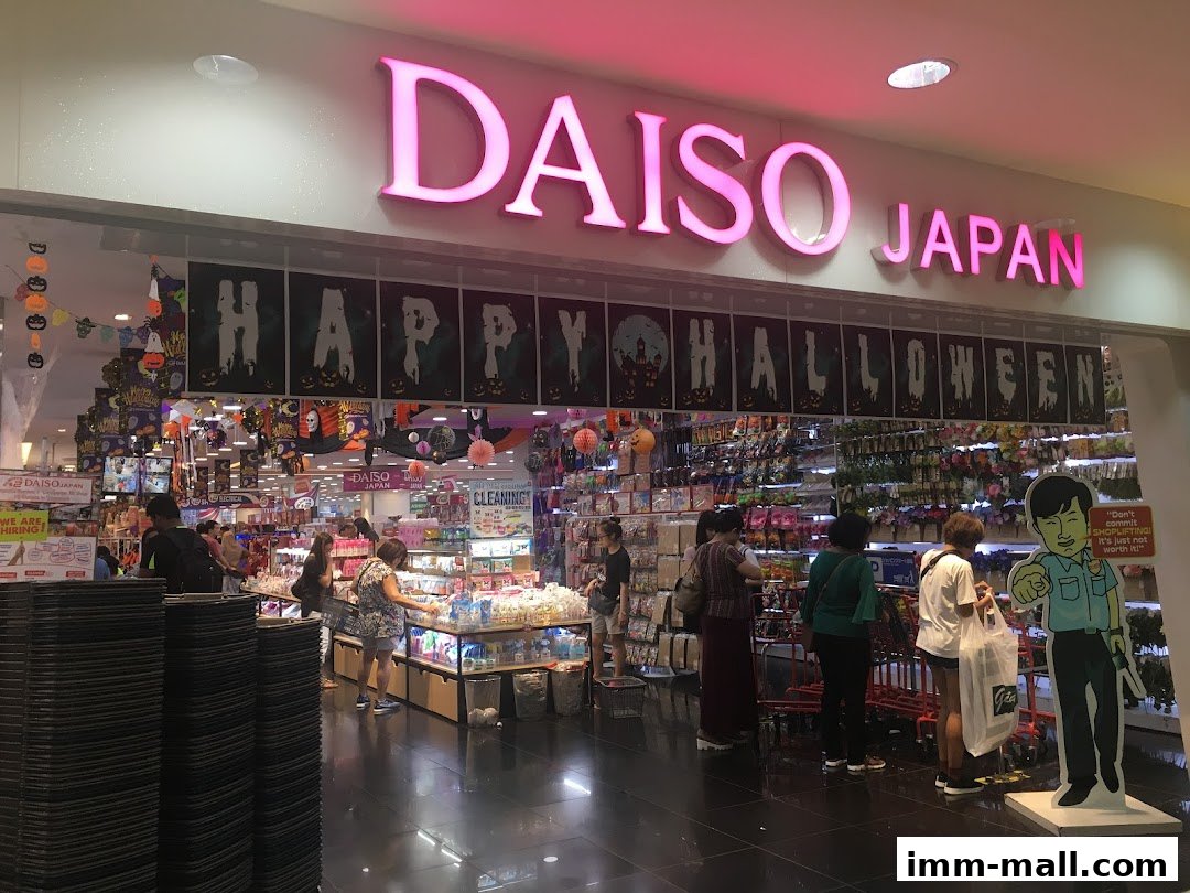 The entrance of a DAISO JAPAN store decorated for Halloween with festive banners and displays.