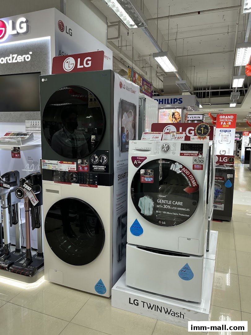 LG washing machines and vacuum cleaners displayed in a retail store.