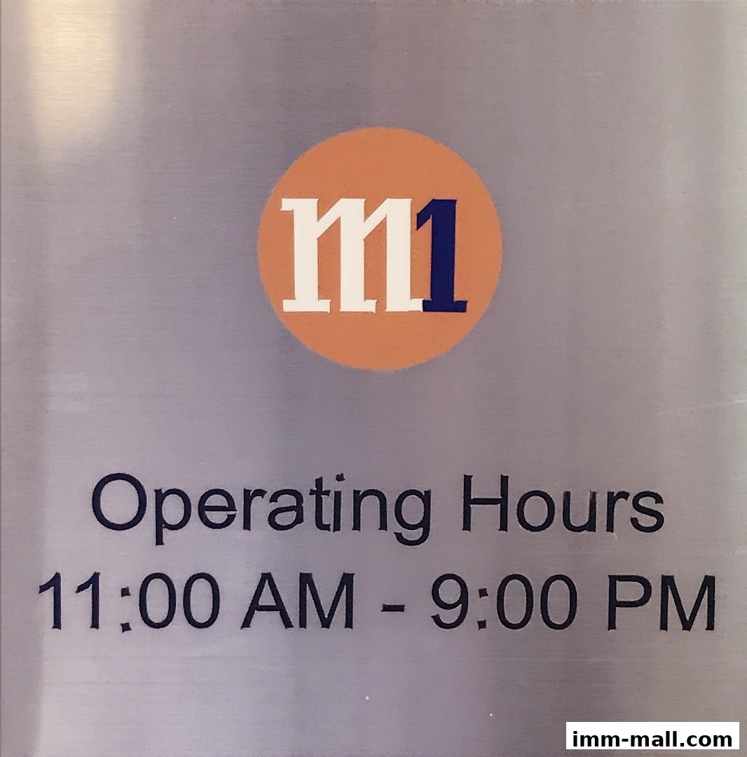 A sign displaying the M1 logo and operating hours for a phone shop.