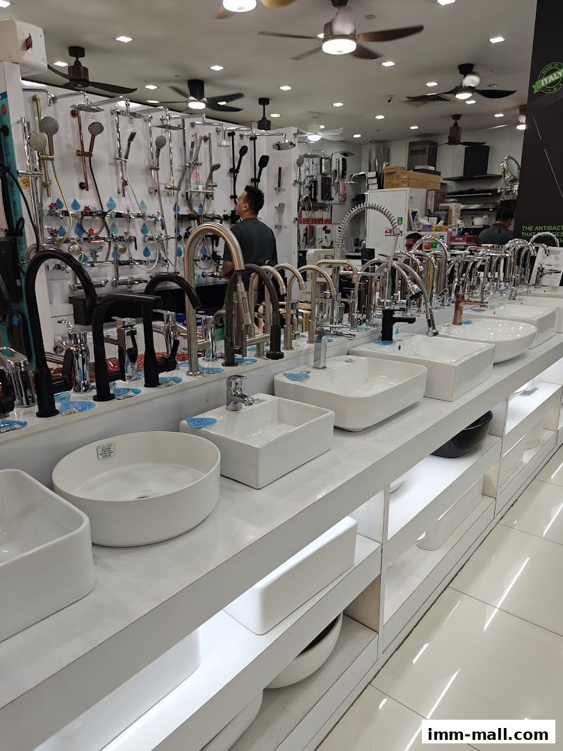 A well-lit showroom displaying a wide variety of bathroom fixtures, including sinks and faucets.