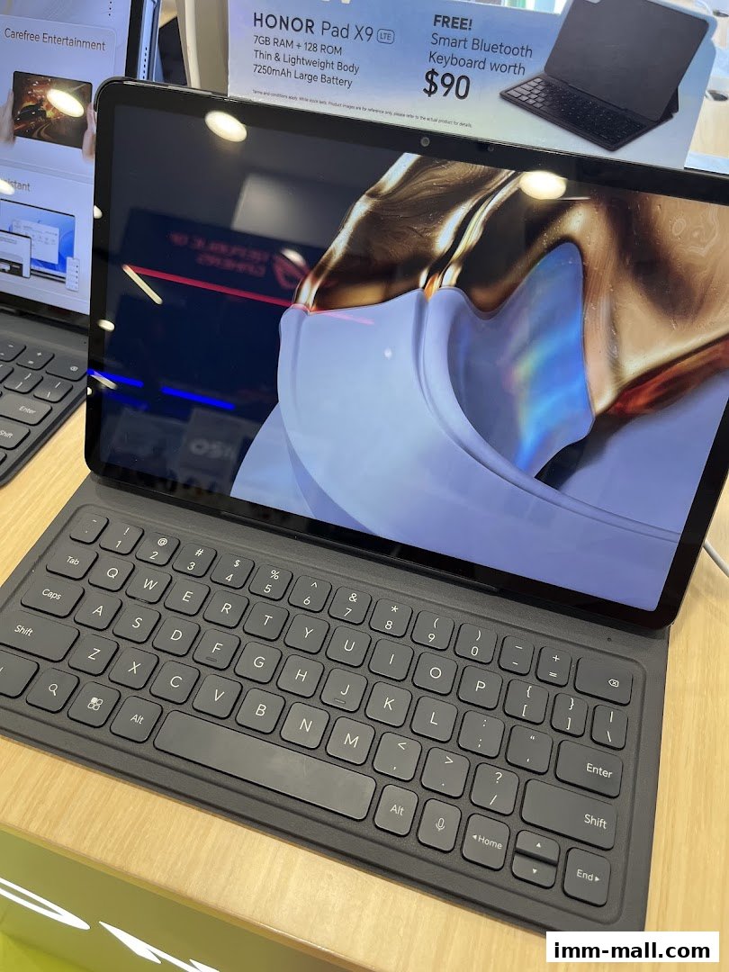 A close-up of a HONOR Pad X9 with a keyboard, showcasing a special offer.