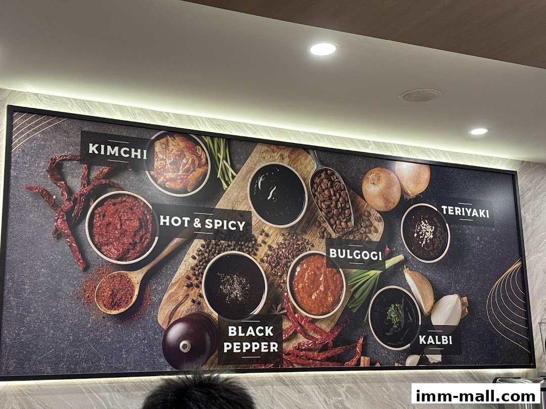 A display board showcasing various Korean hot pot soup bases and ingredients.