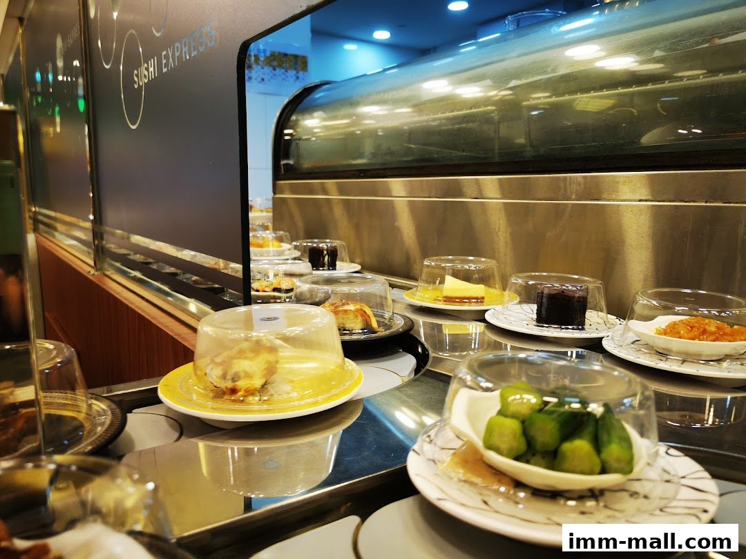 Sushi Express conveyor belt with various dishes and desserts on plates.