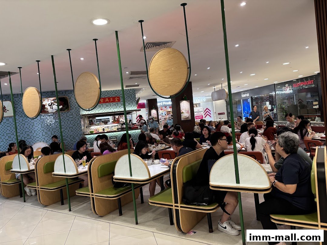 Interior view of a busy Wan Chai Hongkong Tea Room with many diners seated at tables.
