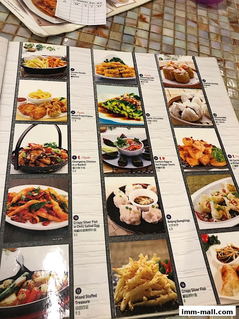 A menu from Streats IMM featuring various Asian dishes with appealing food photography.