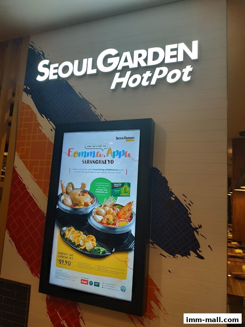 A digital display board outside Seoul Garden Hot Pot showcasing a special set menu.