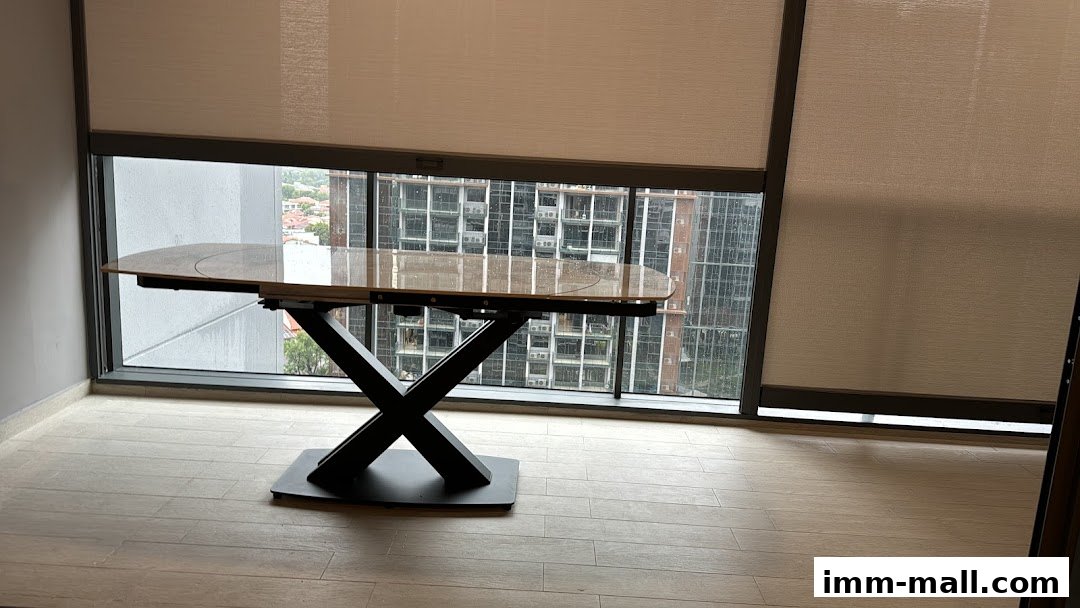 A modern dining table with a marble-patterned top and black X-shaped legs, positioned by a large window.