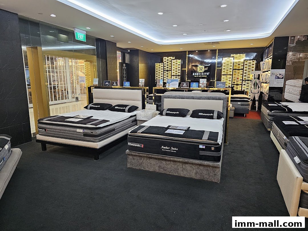 Interior of a Sealy Sleep Boutique showcasing various mattresses and beds.