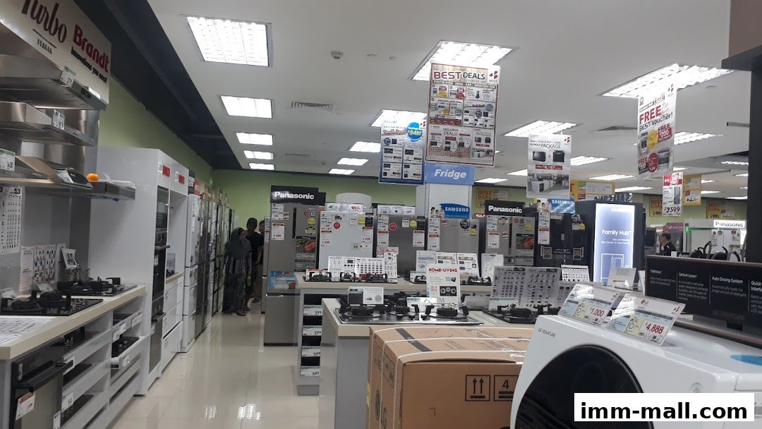 Interior view of an electronics store showcasing various appliances like refrigerators and stoves.