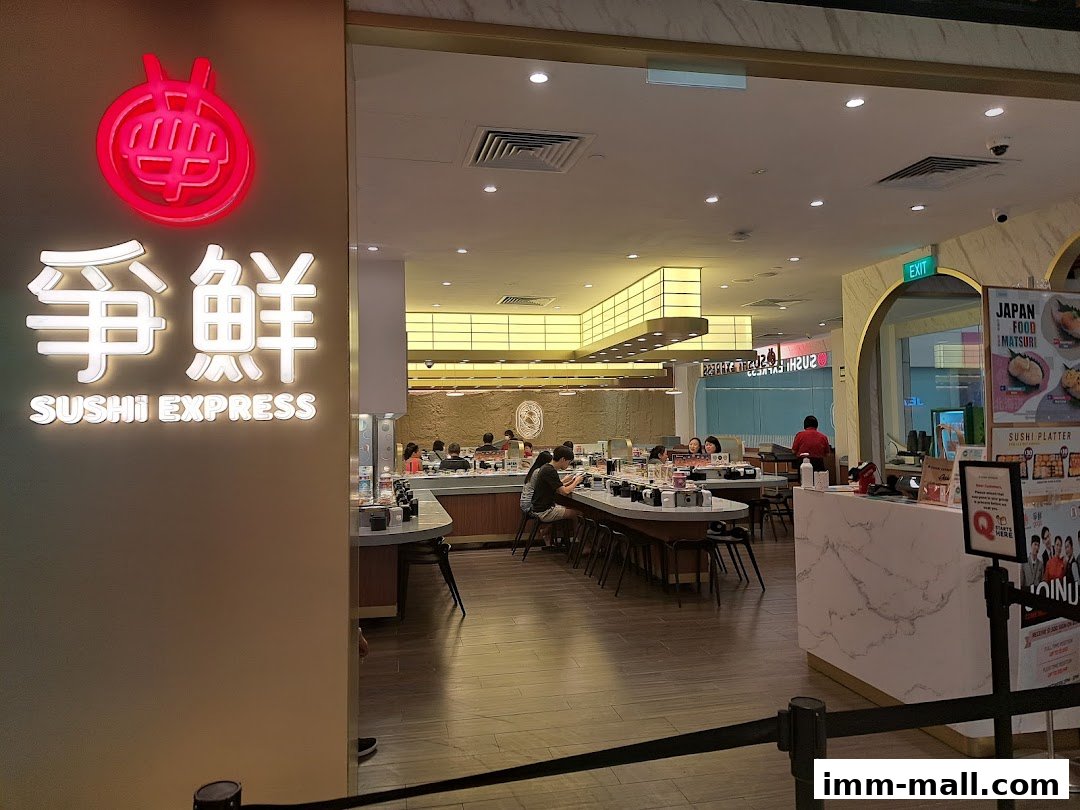 The exterior of Sushi Express, a Japanese restaurant, with customers dining inside.