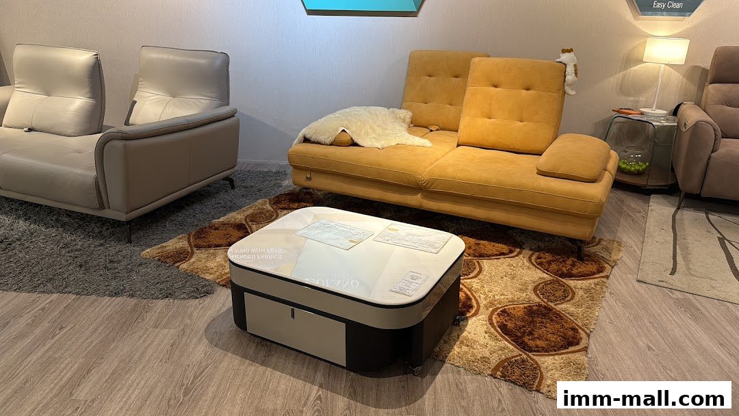 A modern living room setup featuring a yellow sofa, a beige leather sofa, and a coffee table.
