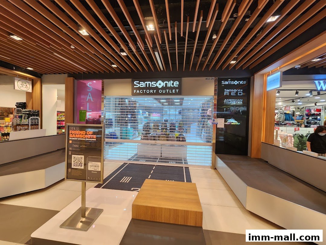 The Samsonite Factory Outlet store entrance with a closed roller shutter and sale signage.
