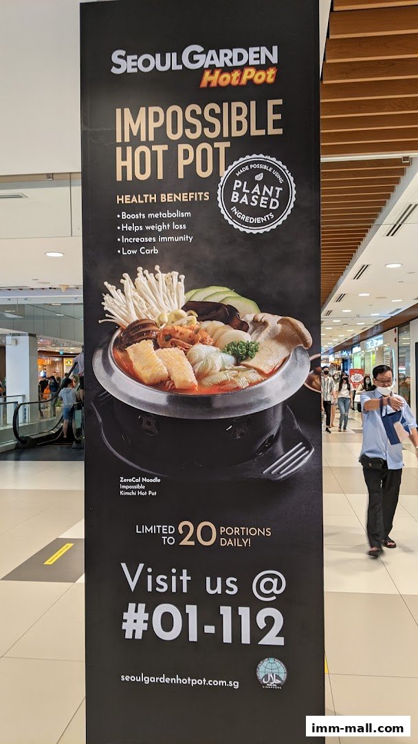 A large banner advertises Seoul Garden Hot Pot's Impossible Hot Pot with health benefits.