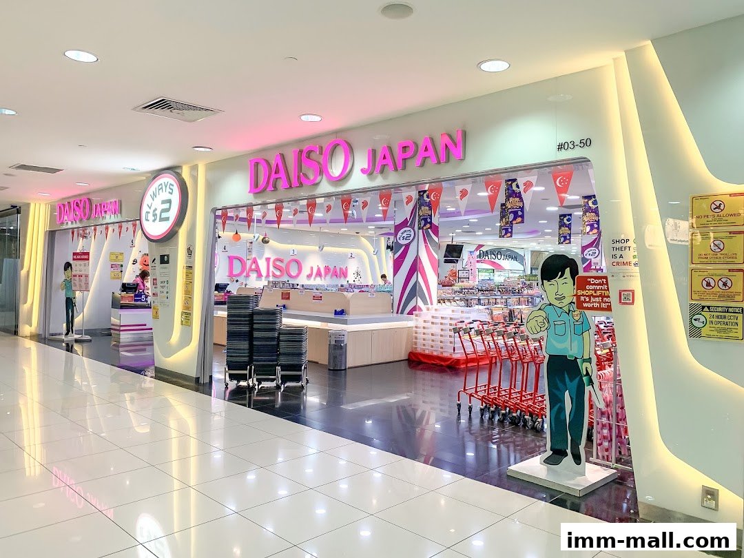 The brightly lit entrance of a Daiso Japan store, featuring prominent signage and shopping carts.