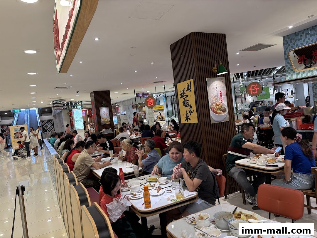 A busy Hong Kong-style tea room with many customers dining at tables.
