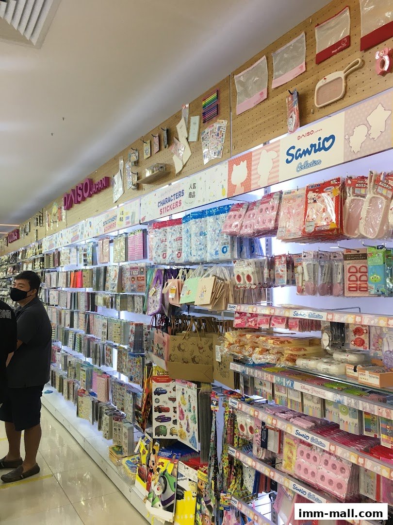 Interior view of a Daiso store showcasing a wide variety of stationery, stickers, and character merchandise.