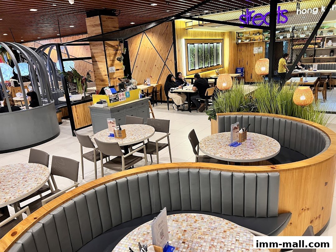 Interior view of a modern restaurant with booth seating and tables.