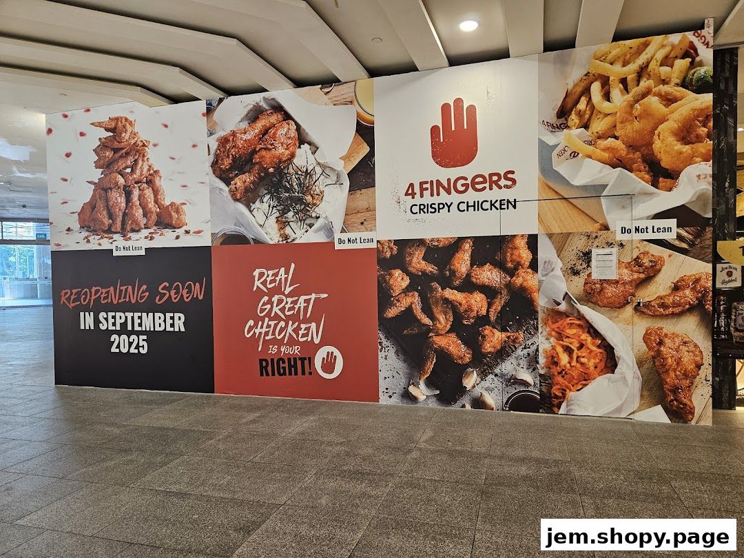 A large mural for 4 Fingers Crispy Chicken announcing their reopening in September 2025.