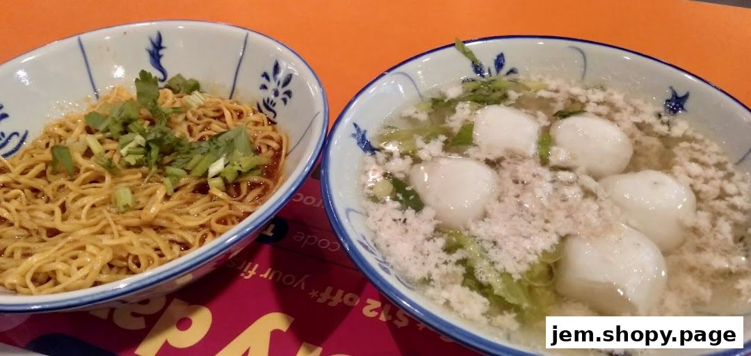 Two bowls of noodles and soup with fish balls from Ah Ma Chi Mian.