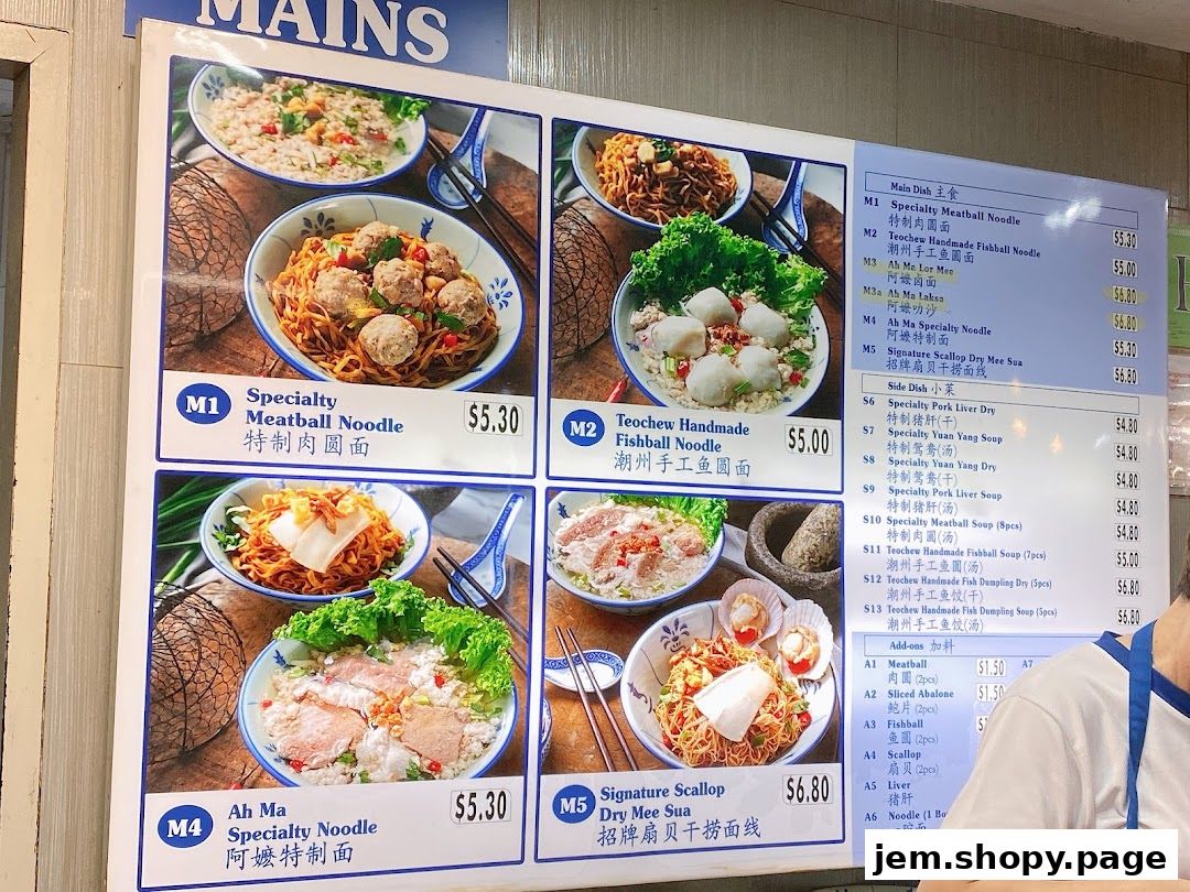 A menu board displaying various noodle dishes and side dishes with prices.