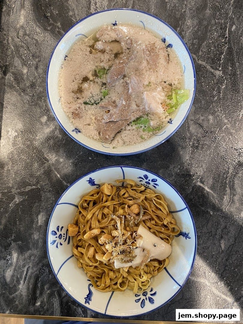 Two bowls of noodles, one dry and one in soup, from Ah Ma Chi Mian.