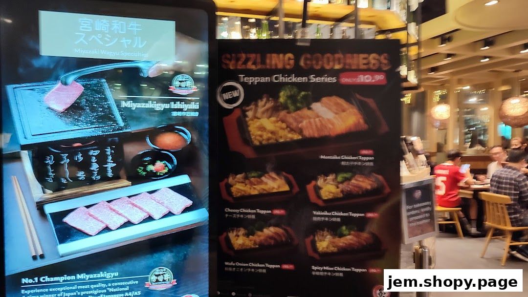 A menu board displays Miyazaki Wagyu specialties and Teppan Chicken Series dishes.