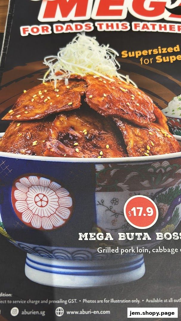 A close-up of a 'Mega Buta Boss' dish with grilled pork loin and cabbage.