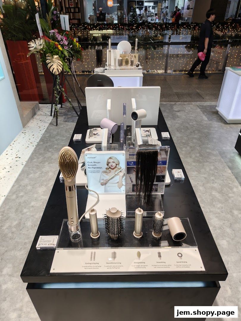 Display of Airbot hair styling tools with various attachments and a promotional image.