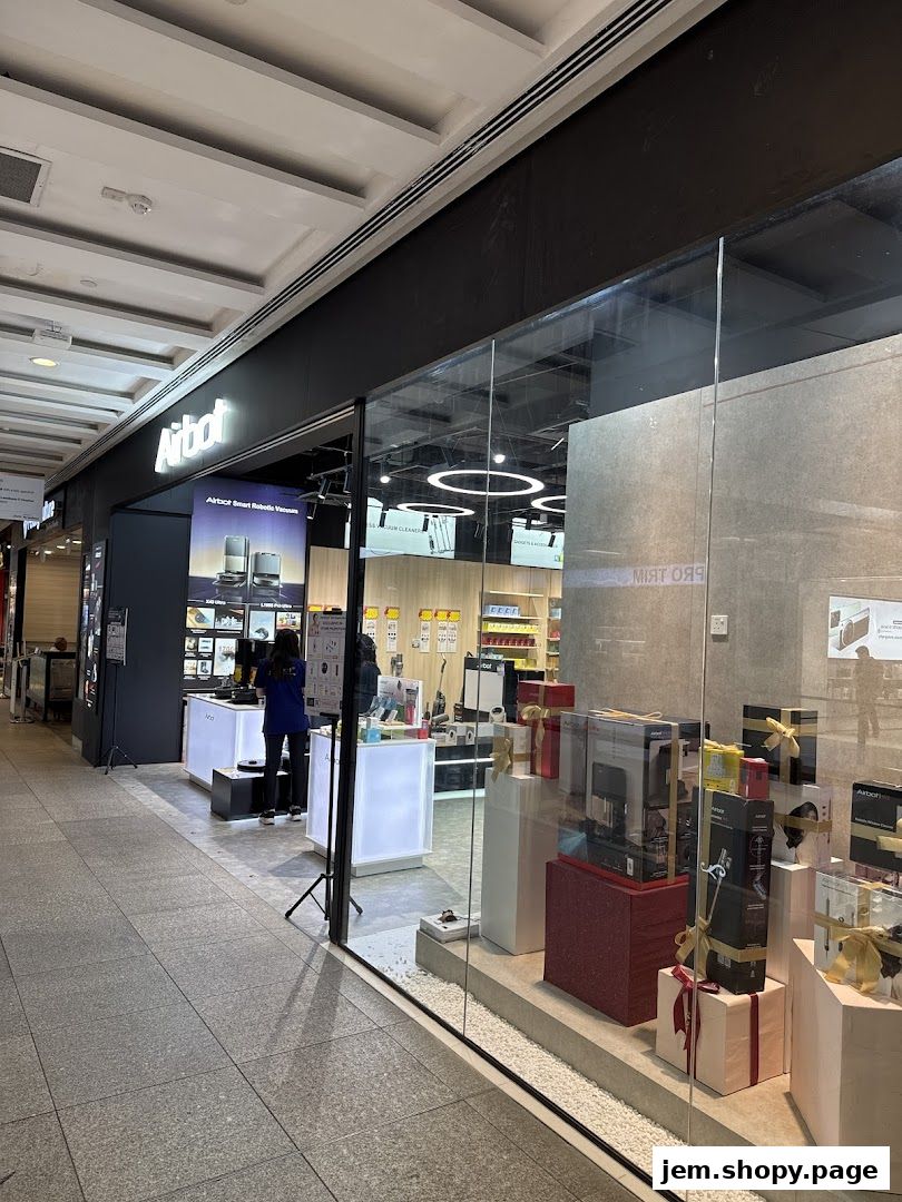The exterior of the Airbot JEM shop, showcasing robotic vacuums and other smart home devices.