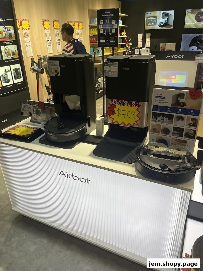Airbot robotic vacuum cleaners displayed on a counter with promotional signage.