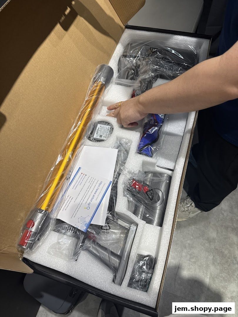 A person unboxing a new Airbot vacuum cleaner with various attachments.