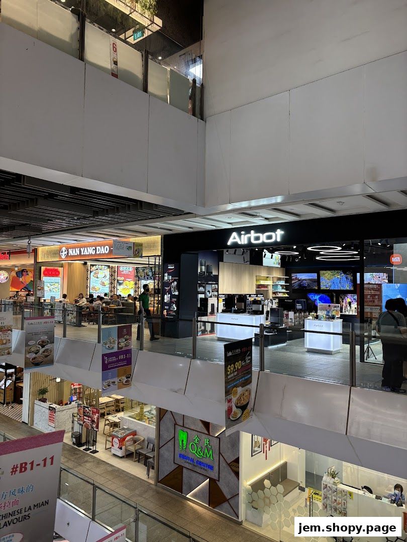 A view of the Airbot store and surrounding shops in a mall.