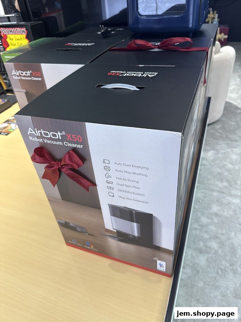 Boxes of Airbot X50 Robot Vacuum Cleaners are displayed, some with red bows.