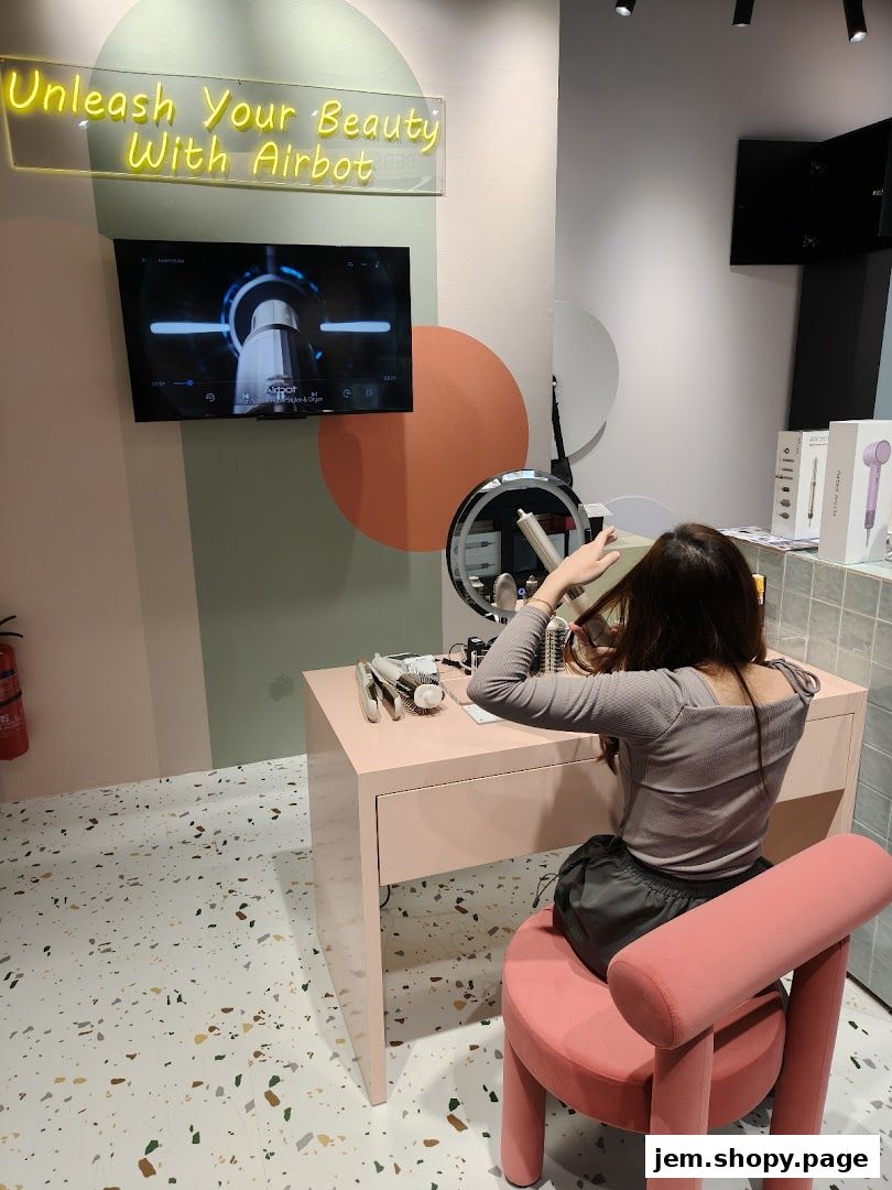A woman tries out a beauty product at a vanity in the Airbot JEM store.