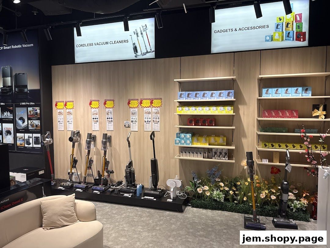 A retail store display featuring cordless vacuum cleaners and various gadgets and accessories.
